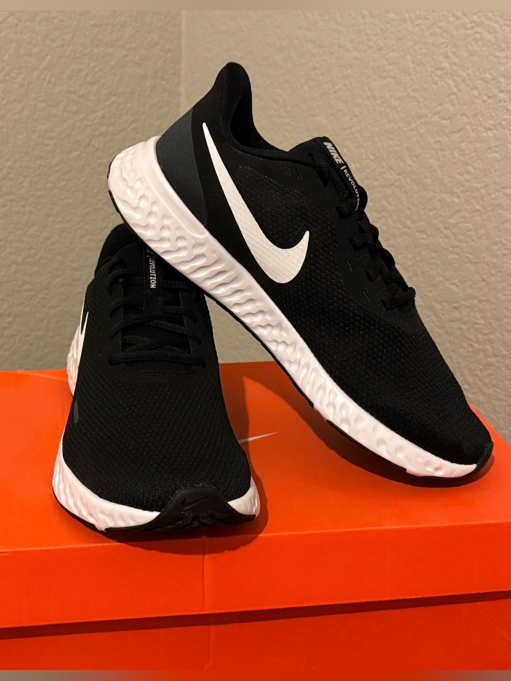 Nike Women's Revolution Black and White Running Shoes 
9.5 wide